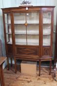 Edwardian inlaid mahogany breakfornt vitrine on six square tapering legs to spade feet,