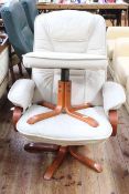 Ivory leather reclining swivel chair and footstool.