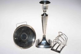 Art Deco silver toast rack, Birmingham 1936, silver Churchill shallow dish, and loaded candlestick.