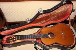 Taurus acoustic guitar and case.