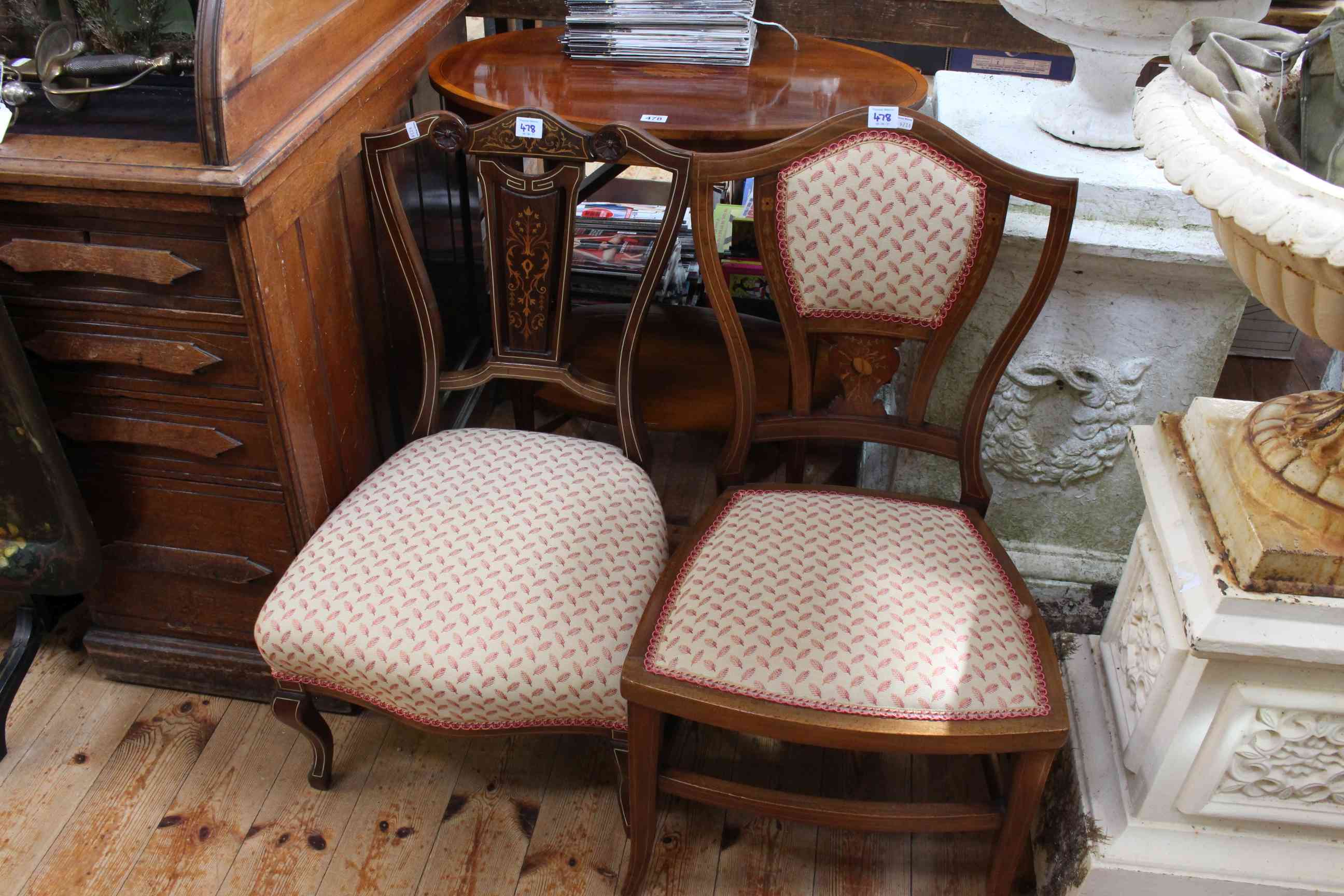 Inlaid mahogany oval occasional table and two Victorian/Edwardian nursing chairs (3).