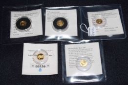 Five World's Smallest Gold Coins by Westminster.