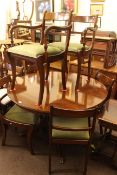 Circular mahogany extending pedestal dining table,