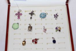 Collection of eleven silver gem set pendants.