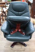 Green leather reclining swivel chair and footstool.