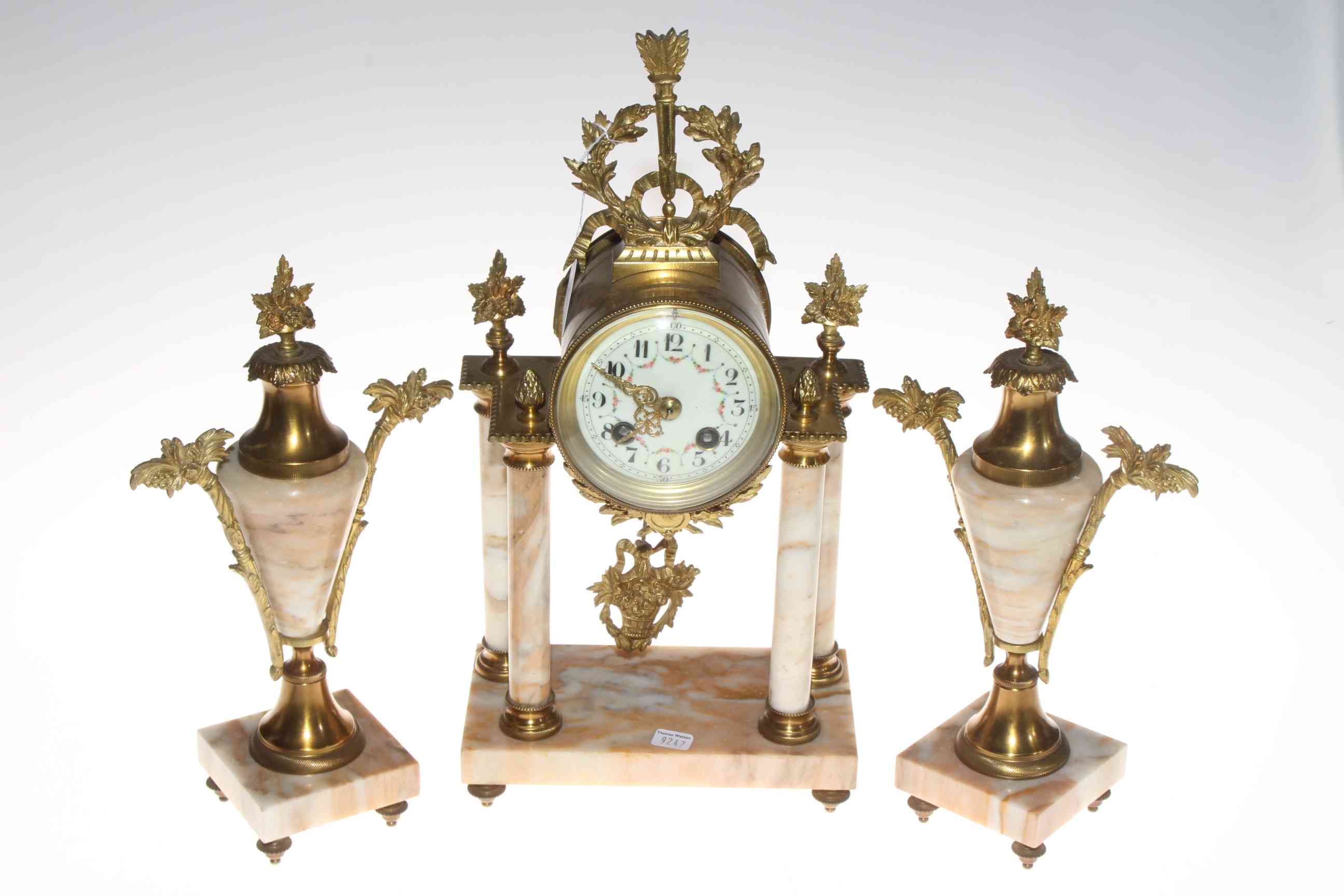 Ornate gilt metal and marble clock set.
