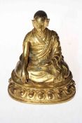 Chinese gilt bronze Buddha, with incised mark to base, 17cm.