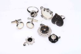 Silver jewellery comprising two rings, three pendants and cufflinks.