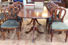Mahogany twin pedestal extending dining table and six Victorian style dining chairs.