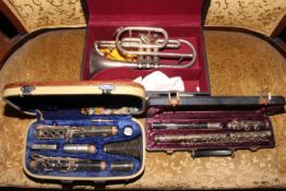 Besson cornet, cased flute, Chinese clarinet.