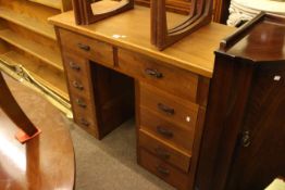 Hardwood ten drawer pedestal desk, 78cm high by 98cm wide by 46cm deep.