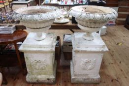 Pair terracotta pedestal garden urns on square plinths, 112cm high including plinths.