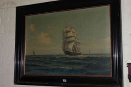 Large signed oil on canvas of a triple masted ship at sea, 60cm by 88cm, in ebonised frame.