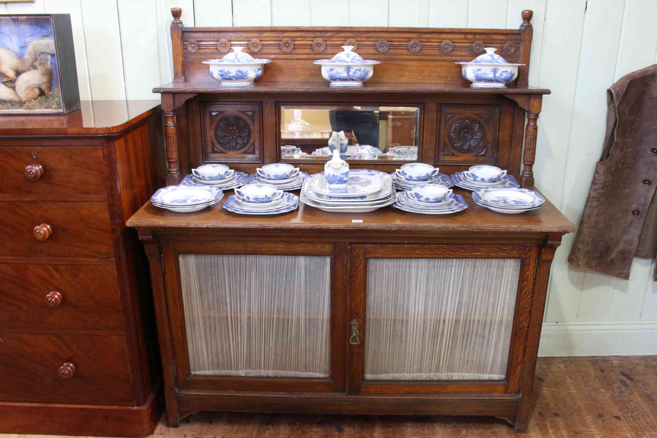 Pratts of Bradford late 19th/early 20th Century oak side cabinet having canopied mirror back above