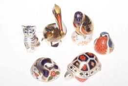 Six Royal Crown Derby paperweights, Brown Pelican, Tortoise, Mole, Cat and two Birds.