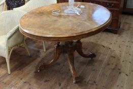 Victorian figure walnut and satinwood inlaid oval breakfast table on four turned pillars to four