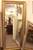 Gilt framed rectangular wall mirror, 171cm by 80cm overall.