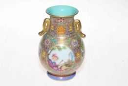 Fine Chinese porcelain two handled vase painted with four panels of figures on intricate ground,