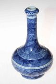 Chinese blue and white bottle vase having overall decoration of creatures in cloud forms, 28cm.