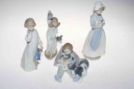 Lladro collection of four children figures including girl and dog with lantern (4).