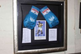 Large framed autographed boxing gloves, picture and career record signed by John Conteh.