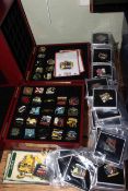 Collection of Danbury Mint enamel pin badges with two presentation boxes.