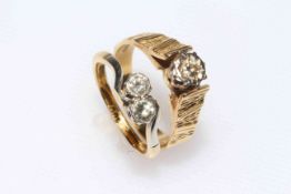 Two 18 carat gold and diamond set rings, one single stone, the other with two crossover stones.