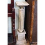 Pair marble and brass reeded column torcheres, 101cm high by 25cm by 25cm.