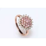 9 carat gold diamond and gem set (possibly pink tourmaline) cluster ring, size P.