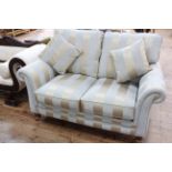 Two seater settee in striped fabric.