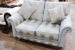 Two seater settee in striped fabric.