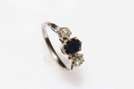 18 carat white gold three stone sapphire and diamond ring, size M.