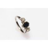 18 carat white gold three stone sapphire and diamond ring, size M.