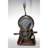 Ships wheel in the form of barometer lamp.