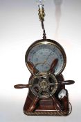 Ships wheel in the form of barometer lamp.