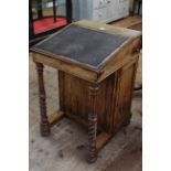 Victorian walnut Davenport having secret drawer fitted with stationery compartment and ink bottle