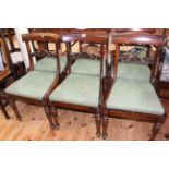 Set of six Victorian rosewood carved rail back dining chairs on turned legs.