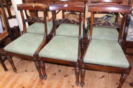 Set of six Victorian rosewood carved rail back dining chairs on turned legs.
