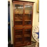Early 20th Century mahogany glazed four door bookcase, 214cm high by 98.5cm wide by 35cm deep.