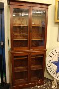 Early 20th Century mahogany glazed four door bookcase, 214cm high by 98.5cm wide by 35cm deep.