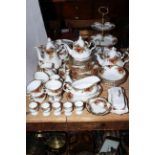 Royal Albert Country Roses including teapot, tureen, butter dish, approximately fifty pieces.