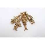 Collection of four 9 carat gold figure, teddy bear and reticulated fish charms/pendants,