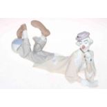 Lladro reclining clown with ball, 37cm length.