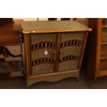 Wicker and simulated bamboo two door side cabinet, 87cm high by 82cm wide by 41cm deep.