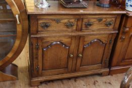 Good quality period style oak dresser having two drawers above two arched fielded panel doors, 91.