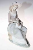 Lladro figure of seated lady with puppy on her lap, 33cm.