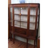 Edwardian inlaid mahogany breakfront vitrine on six square tapering legs to spade feet,