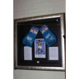 Large framed autographed boxing gloves, picture and career record signed by John Conteh.