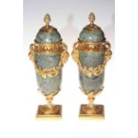 Pair of marble and gilt bronze urns, 32cm high.
