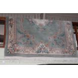 Chinese carpet with a floral pattern on green ground 2.80 by 1.80.